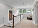 Hallway features neutral walls, plush carpet, and a window bench with storage at 2908 Mabry Ne Ln, Brookhaven, GA 30319