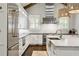 Modern kitchen featuring white cabinets, marble countertops, and stainless steel appliances at 2908 Mabry Ne Ln, Brookhaven, GA 30319