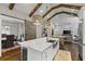 Spacious kitchen island with marble countertops, farmhouse sink, and wine cooler at 2908 Mabry Ne Ln, Brookhaven, GA 30319