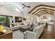 Open living room with vaulted ceilings, exposed beams, and hardwood floors at 2908 Mabry Ne Ln, Brookhaven, GA 30319
