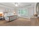 The main bedroom has a tray ceiling and large windows that provide ample natural light at 2908 Mabry Ne Ln, Brookhaven, GA 30319