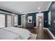 Spacious main bedroom featuring hardwood floors, gray dresser, and white trim, offering style and comfort at 2908 Mabry Ne Ln, Brookhaven, GA 30319