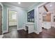Office featuring a view to laundry room, white cabinets, granite countertops, and hardwood floors at 2908 Mabry Ne Ln, Brookhaven, GA 30319