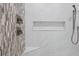 Modern shower with decorative tile and built-in niche, offering a spa-like experience with stylish and functional design at 2908 Mabry Ne Ln, Brookhaven, GA 30319