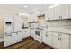 Modern kitchen with white shaker cabinets and new appliances at 684 S Elizabeth Nw Pl, Atlanta, GA 30318