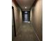 Interior hallway featuring modern design and clean lines, leading to a doorway at 44 Peachtree Ne Pl # 424, Atlanta, GA 30309