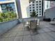 Outdoor patio space with patio furniture and a view of the surrounding cityscape and greenery at 44 Peachtree Ne Pl # 424, Atlanta, GA 30309