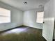 Neutral carpeted bedroom featuring two windows providing lots of natural light at 2924 Sylvan Rd, East Point, GA 30344