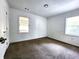 Neutral carpeted bedroom featuring two windows providing lots of natural light at 2924 Sylvan Rd, East Point, GA 30344