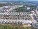 Aerial view of a Gathering-friendly neighborhood highlighting the community pond, single-Gathering homes, and convenient roadways at 4444 Kendrick Cir, Loganville, GA 30052