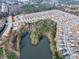 An aerial view highlighting the community's pool and nearby pond, nestled within a well-planned residential neighborhood at 4444 Kendrick Cir, Loganville, GA 30052