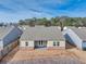 An aerial view of the backyard featuring a covered patio, surrounded by fenced yard space in a residential neighborhood at 4444 Kendrick Cir, Loganville, GA 30052