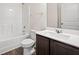 Bathroom features a modern vanity with white countertop and dark wood cabinets at 4444 Kendrick Cir, Loganville, GA 30052