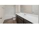 Bathroom with modern vanity, framed mirror, toilet and tub with shower head at 4444 Kendrick Cir, Loganville, GA 30052