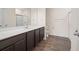 Modern bathroom featuring dark cabinetry, a white countertop, and a stand-up shower at 4444 Kendrick Cir, Loganville, GA 30052