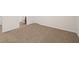 A bedroom with neutral walls and carpet, and a door opening to a bathroom at 4444 Kendrick Cir, Loganville, GA 30052