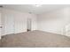 An empty bedroom, showcasing neutral walls and plush carpeting at 4444 Kendrick Cir, Loganville, GA 30052