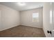 Neutral bedroom with window and carpet at 4444 Kendrick Cir, Loganville, GA 30052