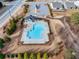 Aerial shot of a community pool in a well-manicured setting, complete with a clubhouse and ample parking at 4444 Kendrick Cir, Loganville, GA 30052