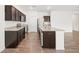 Modern kitchen featuring granite countertops, stainless steel appliances, and a large center island at 4444 Kendrick Cir, Loganville, GA 30052