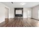 Expansive living room with hardwood floors, modern fireplace, and ample natural light at 4444 Kendrick Cir, Loganville, GA 30052