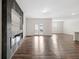 Expansive living room with hardwood floors, modern fireplace, and ample natural light at 4444 Kendrick Cir, Loganville, GA 30052