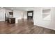 Spacious living room featuring a modern fireplace, granite countertop kitchen island, and hardwood floors at 4444 Kendrick Cir, Loganville, GA 30052