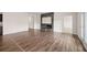 Expansive living room with hardwood floors, modern fireplace, and ample natural light at 4444 Kendrick Cir, Loganville, GA 30052