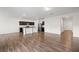 Open-concept living area showcasing the kitchen and dining area with hardwood floors at 4444 Kendrick Cir, Loganville, GA 30052