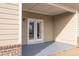Covered patio with double doors at 4444 Kendrick Cir, Loganville, GA 30052