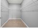 Walk-in closet featuring carpet flooring and wire shelving at 4444 Kendrick Cir, Loganville, GA 30052