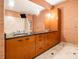 Large bathroom with double vanity and wood cabinets at 3334 Peachtree Ne Rd # 1707, Atlanta, GA 30326