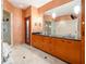 Bathroom with large vanity, glass block shower, and wood cabinets at 3334 Peachtree Ne Rd # 1707, Atlanta, GA 30326