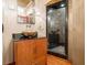 Modern bathroom with glass shower, vessel sink, and wood vanity at 3334 Peachtree Ne Rd # 1707, Atlanta, GA 30326