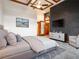 Cozy bedroom with a brick accent wall, soft carpeting, and a modern ceiling fan at 3334 Peachtree Ne Rd # 1707, Atlanta, GA 30326