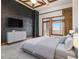 Spacious bedroom with a black brick wall, hardwood floors, and city views at 3334 Peachtree Ne Rd # 1707, Atlanta, GA 30326