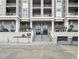 Elegant building entrance with well-maintained landscaping and architectural details at 3334 Peachtree Ne Rd # 1707, Atlanta, GA 30326