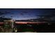 A nighttime city view showcasing lights of a cityscape under a twilight sky at 3334 Peachtree Ne Rd # 1707, Atlanta, GA 30326