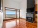 Bright, open living room featuring large windows, a modern fireplace, and gleaming hardwood floors at 3334 Peachtree Ne Rd # 1707, Atlanta, GA 30326