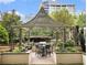 Community patio with seating, grill, and pergola at 3334 Peachtree Ne Rd # 1707, Atlanta, GA 30326