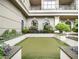 Private putting green nestled within a landscaped courtyard at 3334 Peachtree Ne Rd # 1707, Atlanta, GA 30326