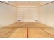 Modern squash court with hardwood floors and crisp white walls at 3334 Peachtree Ne Rd # 1707, Atlanta, GA 30326