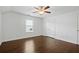 Bright bedroom with wood floors and ceiling fan at 7470 Flintlock Way, Alpharetta, GA 30005