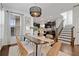 Open concept dining room with kitchen and staircase views at 7470 Flintlock Way, Alpharetta, GA 30005