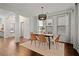 Bright dining room with a modern table and six chairs at 7470 Flintlock Way, Alpharetta, GA 30005