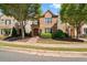 Two-story brick home with manicured lawn and walkway at 7470 Flintlock Way, Alpharetta, GA 30005