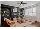 Living room with fireplace and built in shelving at 7470 Flintlock Way, Alpharetta, GA 30005