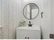 Modern powder room with white vanity and patterned wallpaper at 7470 Flintlock Way, Alpharetta, GA 30005