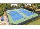 Two well-maintained tennis courts with surrounding fencing at 7470 Flintlock Way, Alpharetta, GA 30005