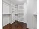 Spacious walk-in closet with ample shelving and hanging space at 7470 Flintlock Way, Alpharetta, GA 30005